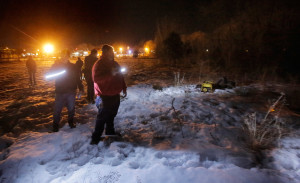 PORTLAND, MAINE - JANUARY 27, 2016: Mike Guthrie, right and Norman Maze, left, lead a group looking for homeless encampments near Forest Avenue during the annual point-in-time homeless count on Wednesday, January 27, 2016. Guthrie works for the City of Portland as a navigator for the Home to Stay program and Maze is the housing director for Shalom House. (Photo by Gregory Rec/Staff Photographer)