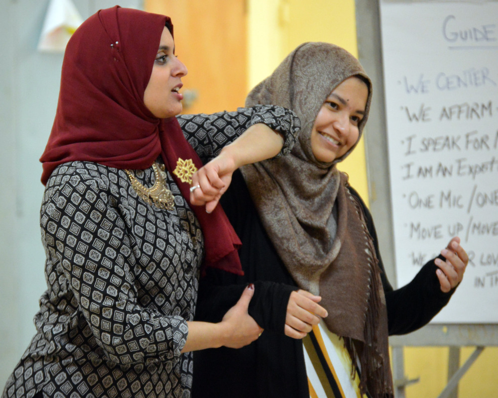 Rana Abdelhamid, left, demonstrates a tactic during a self-defense class in Washington, D.C. Her Women's Initiative for Self-Empowerment teaches young Muslim women martial arts and how to become leaders in their communities.