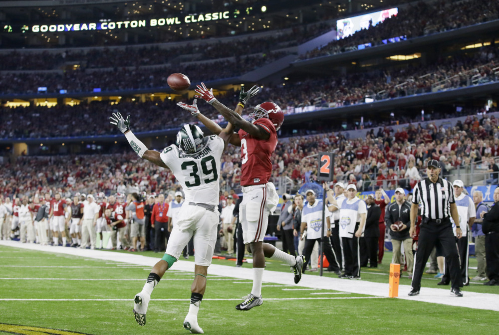 Alabama wide receiver Calvin Ridley makes a touchdown reception over Michigan State cornerback Jermaine Edmondson in the second half, with the Crimson Tide on its way to a 38-0 win and a berth in the national championship game.