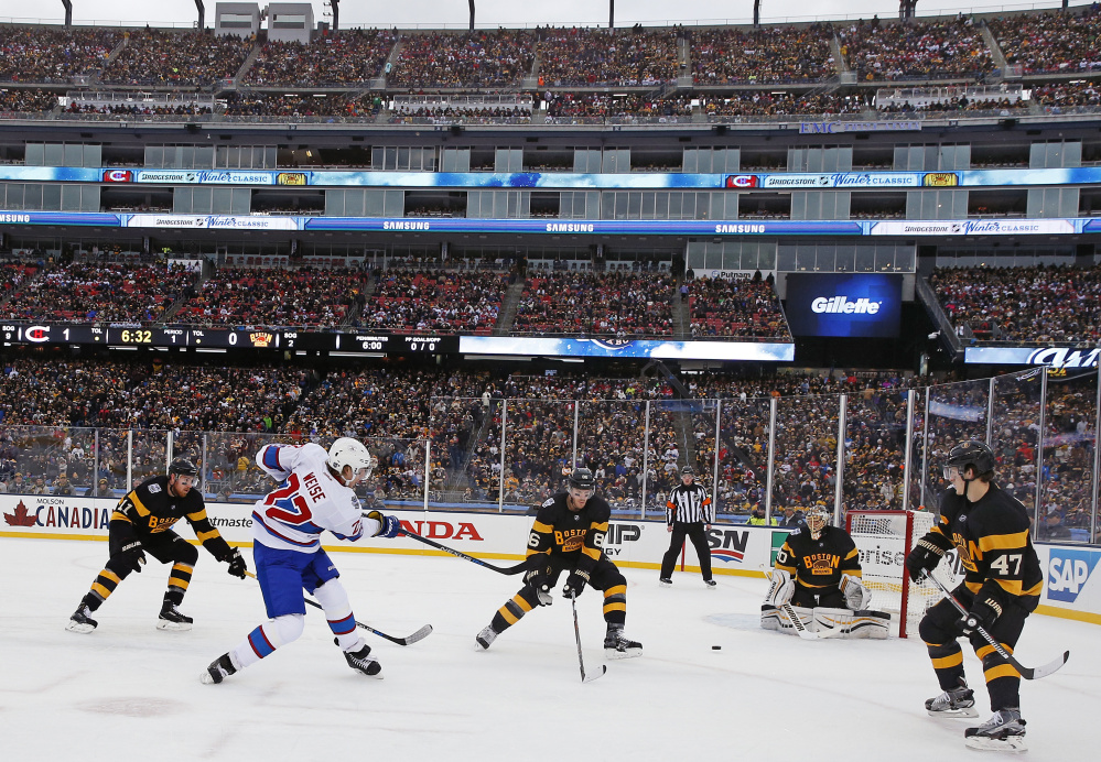 Canadiens right wing Dale Weise, left, takes a shot on Boston Bruins goalie Tuukka Rask during the first period of the Winter Classic Friday at Gillette Stadium in Foxborough, Mass.