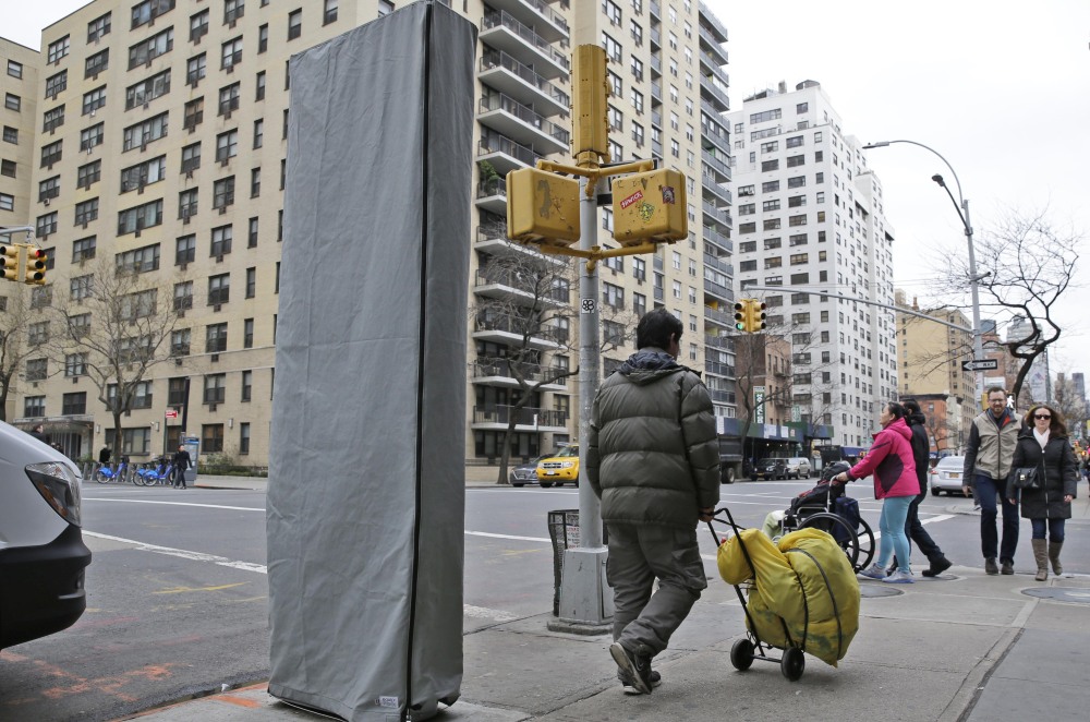 A covered 9-foot-tall, wireless kiosk was installed last week on a Manhattan sidewalk. The first of at least 7,500 planned hot spots are due to go online early this year.