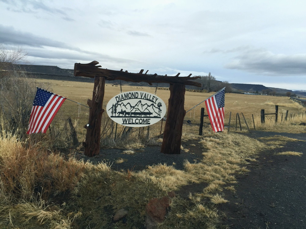 A sign welcomes visitors to the Diamond Valley, part of the Harney Basin in southeast Oregon, in mid-December. The valley is home to large cattle ranches that rely on both private and public land for grazing. The prosecution of Dwight and Steven Hammond for burning public lands has brought fresh focus to the debate over how federal land is managed. 
