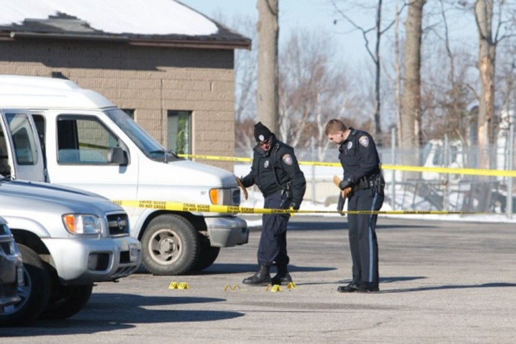 Police investigate a shooting outside a methadone clinic Saturday in Westbrook.