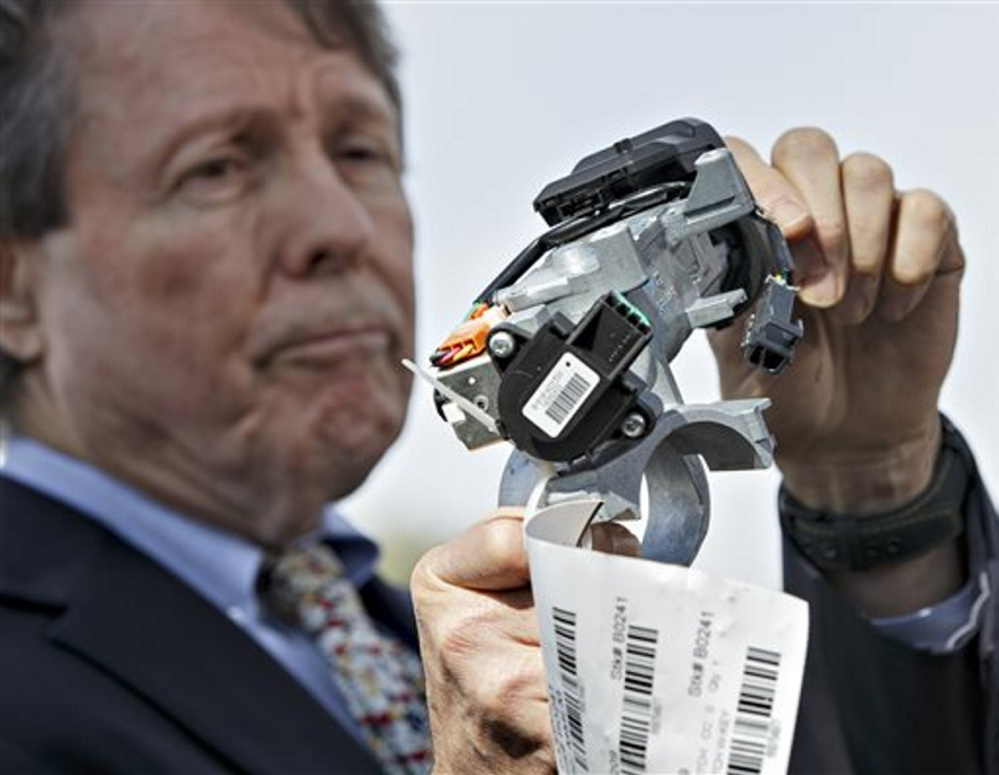 Clarence Ditlow, executive director of the Center for Auto Safety, displays a GM ignition switch similar to those linked to 13 deaths and dozens of crashes of General Motors small cars like the Chevy Cobalt, during an April 2014 news conference on Capitol Hill.
