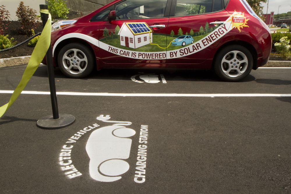 An electric car recharges at a DC Quick Charge station in South Portland. Taking issue with a subhead that an editor wrote for a recent op-ed, a reader says that people with ecological concerns are more patriotic than those who don’t care about the environment.