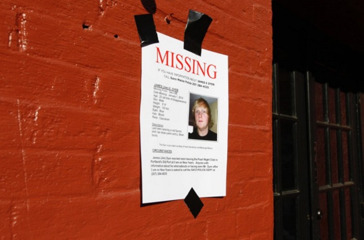 Posters are plastered on the walls of the Old Port in Portland, where James Dyer was last seen early New Year’s Day.