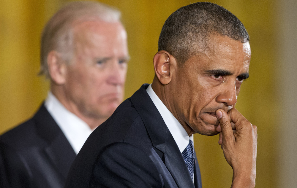 An emotional President Obama, joined by Vice President Joe Biden, pauses Tuesday as he recalls the 20 first-graders killed by a gunman in 2012 at Sandy Hook Elementary School in Newtown, Conn.