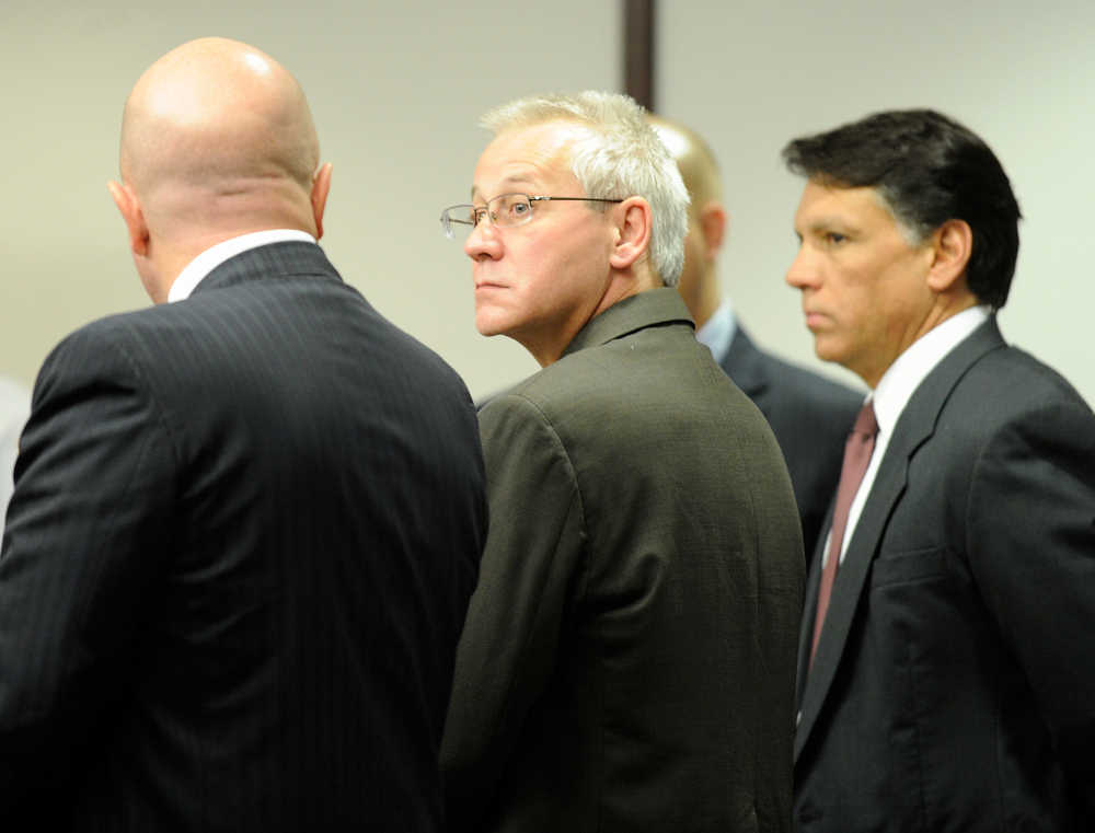 In this Thursday, April 19, 2012, file photo, Oscar Ray Bolin Jr., center, watches as the jurors walk into the courtroom  in Tampa. Bolin Jr,, who has been convicted 10 times for three separate slayings, is scheduled to die for one of them on Thursday.