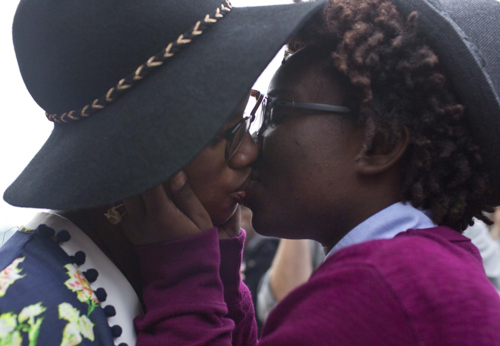 Tori Sisson, left, and Shante Wolfe kiss after saying their marriage vows in Montgomery, Ala., last year. A University of Alabama law professor described the state chief justice’s defiance of the U.S. Supreme Court ruling legalizing same-sex marriage as “an exercise in futility.”