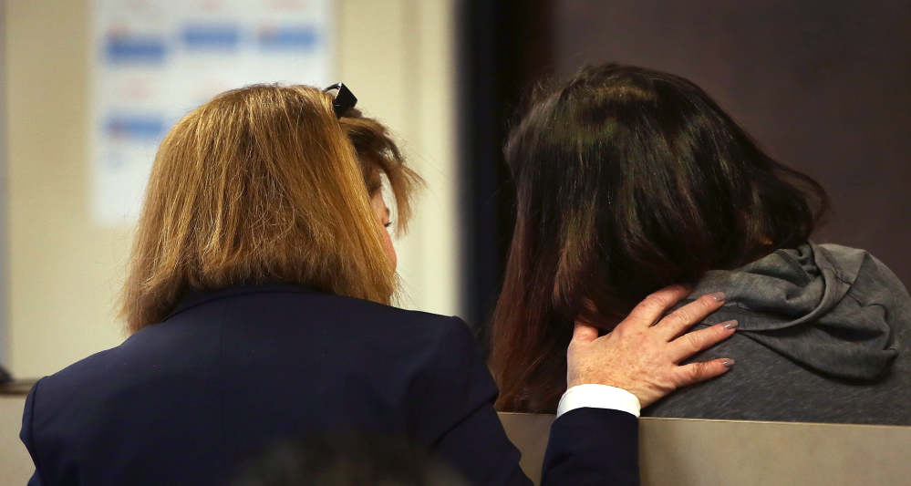 Rachelle Bond, right, consults with her defense attorney, Janice Bassil, as she is arraigned before Magistrate Edward J. Curley in Suffolk Superior Court in Boston on Wednesday.