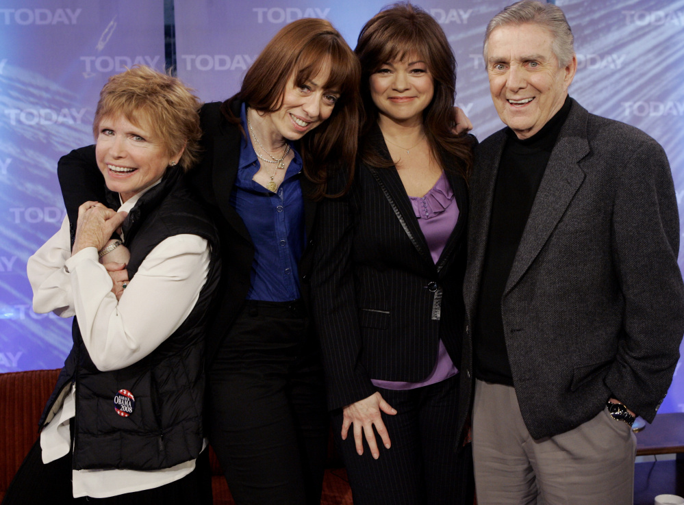 “One Day at a Time” cast members, from left, Bonnie Franklin, MacKenzie Phillips and Valerie Bertinelli, pose with Pat Harrington Jr. during a reunion in 2008.