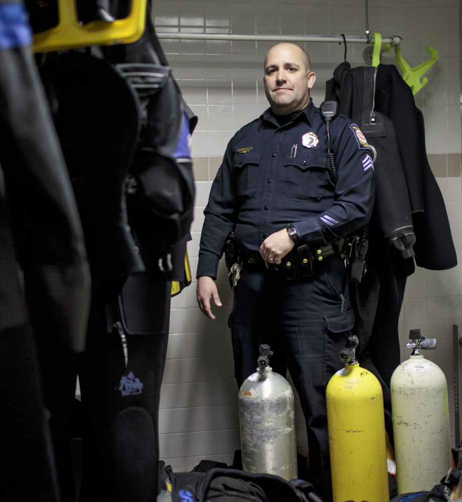 Sgt. Andrew Hutchings of the Portland Police Department poses in the dive team locker Thursday. Hutchings, who has been on the force since 1998, is the supervisor of the search and recovery team that looks for objects or bodies in the water.
Gabe Souza/Staff Photographer