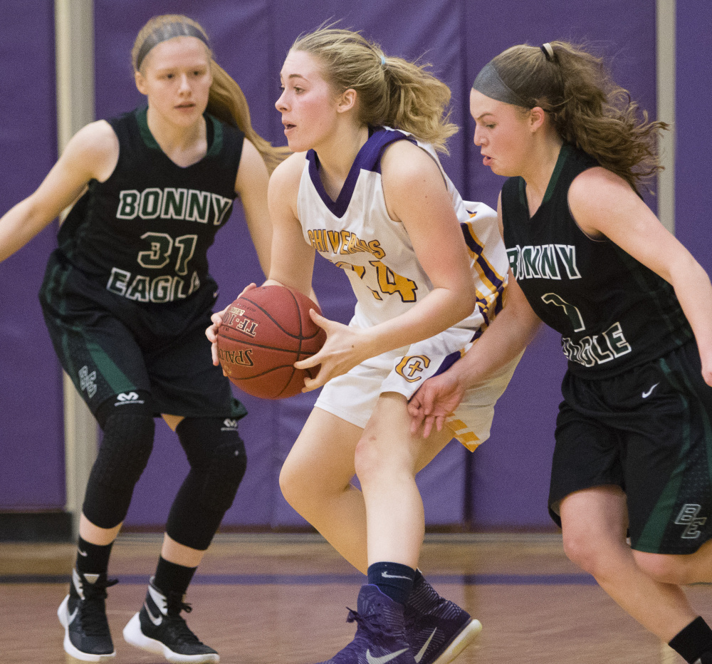 Cheverus’ Deirdre Sanborn looks to pass the ball in heavy traffic Bonny Eagle’s Jennifer Turner, left, and MacKenzie Emery during varsity basketball action at Cheverus. Carl D. Walsh/Staff Photographer