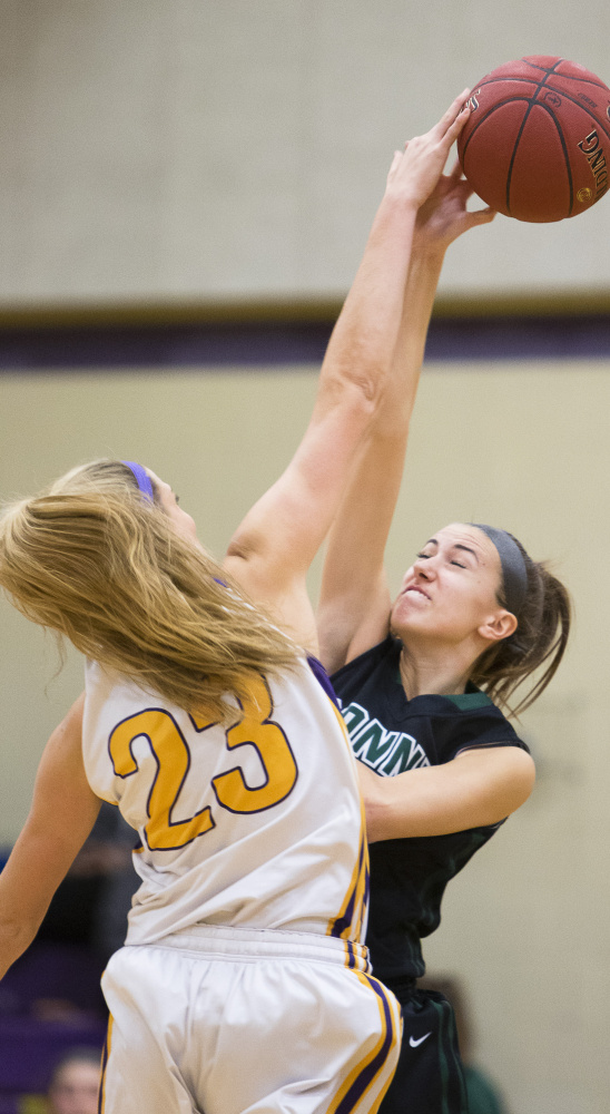 Brooke McElman of Cheverus, left, and Bonny Eagle’s Natalie Bushey vie for the ball during their game Friday night in Portland. Cheverus had little trouble in a 57-35 victory.