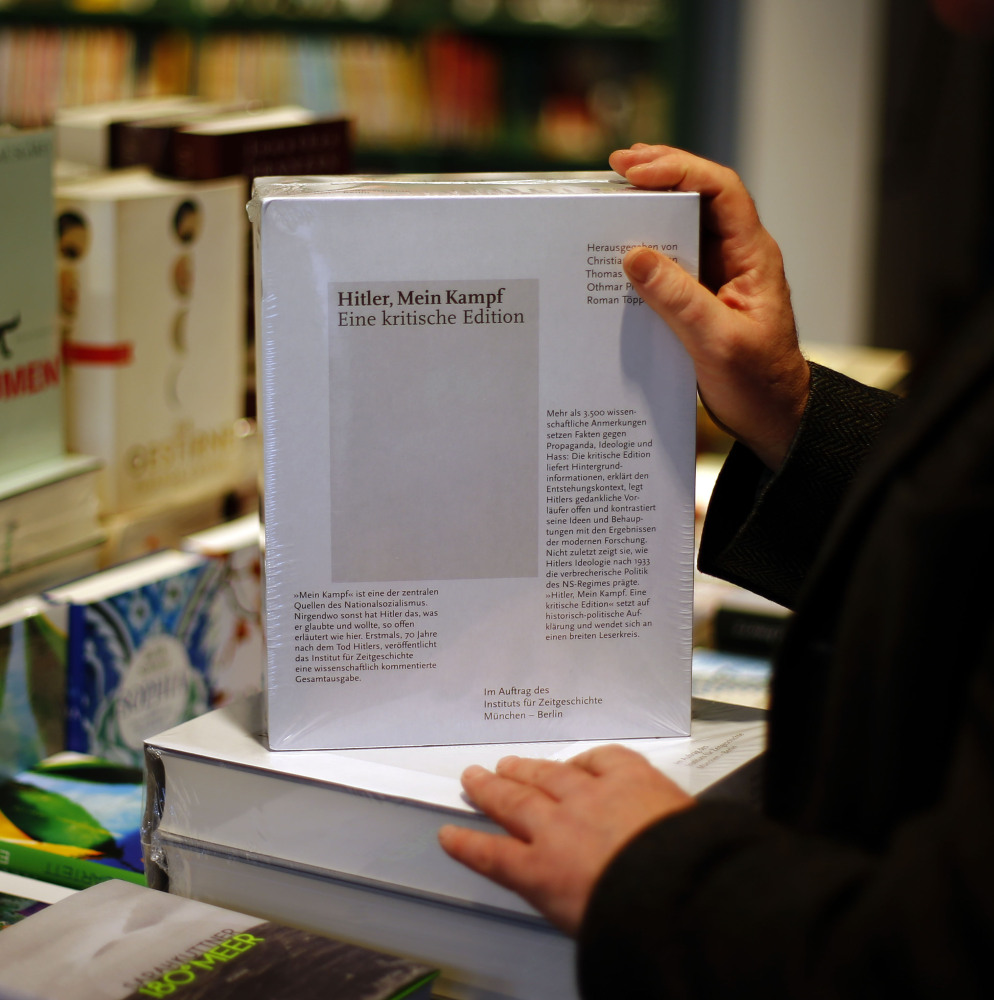 A clerk places a copy of the annotated edition of “Hitler, Mein Kampf: A Critical Edition” in a bookstore in Munich, Germany, on Friday.
The Associated Press