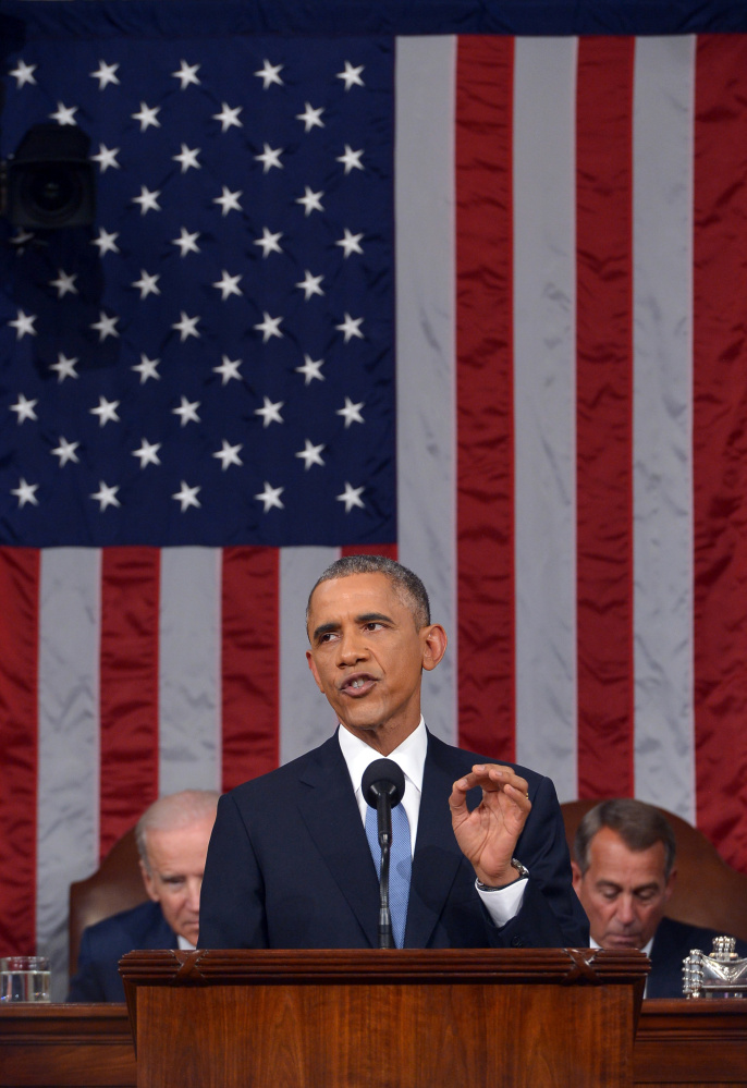 President Obama delivers his State of the Union address to a joint session of Congress on Jan. 20, 2015, in Washington. Vice President Joe Biden and House Speaker John Boehner of Ohio, listen in the background.