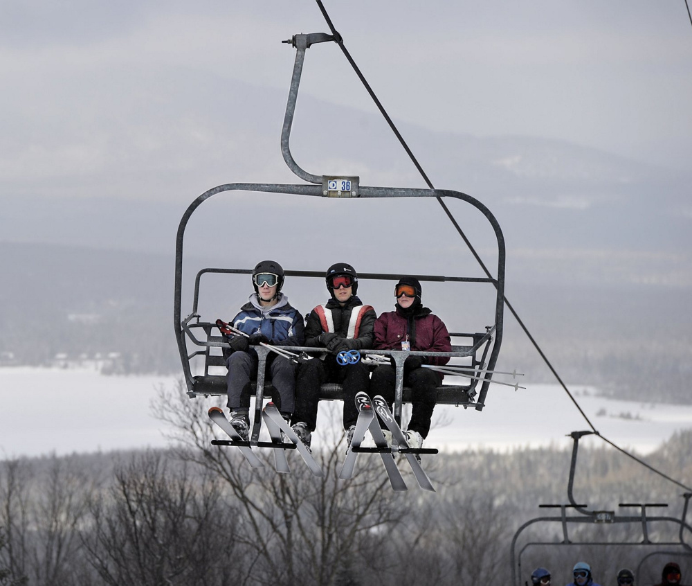 Saddleback skiers ride the South Branch Quad lift. The ski area’s owners have agreed to sale terms with a buyer.