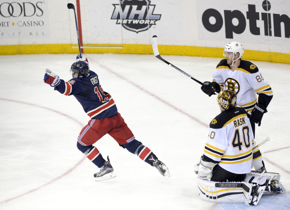 The Rangers’ Jesper Fast celebrates his game-winning goal as Bruins Kevan Miller and goaltender Tuukka Rask look on with just 1:42 left in the third period. The Rangers defeated the Bruins, 2-1.