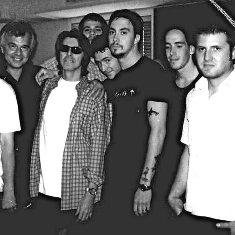 Dave Gutter, center, and other members of the Maine band Rustic Overtones stand with David Bowie, wearing sunglasses, during a Long Island recording session in 1999. Courtesy Dave Gutter