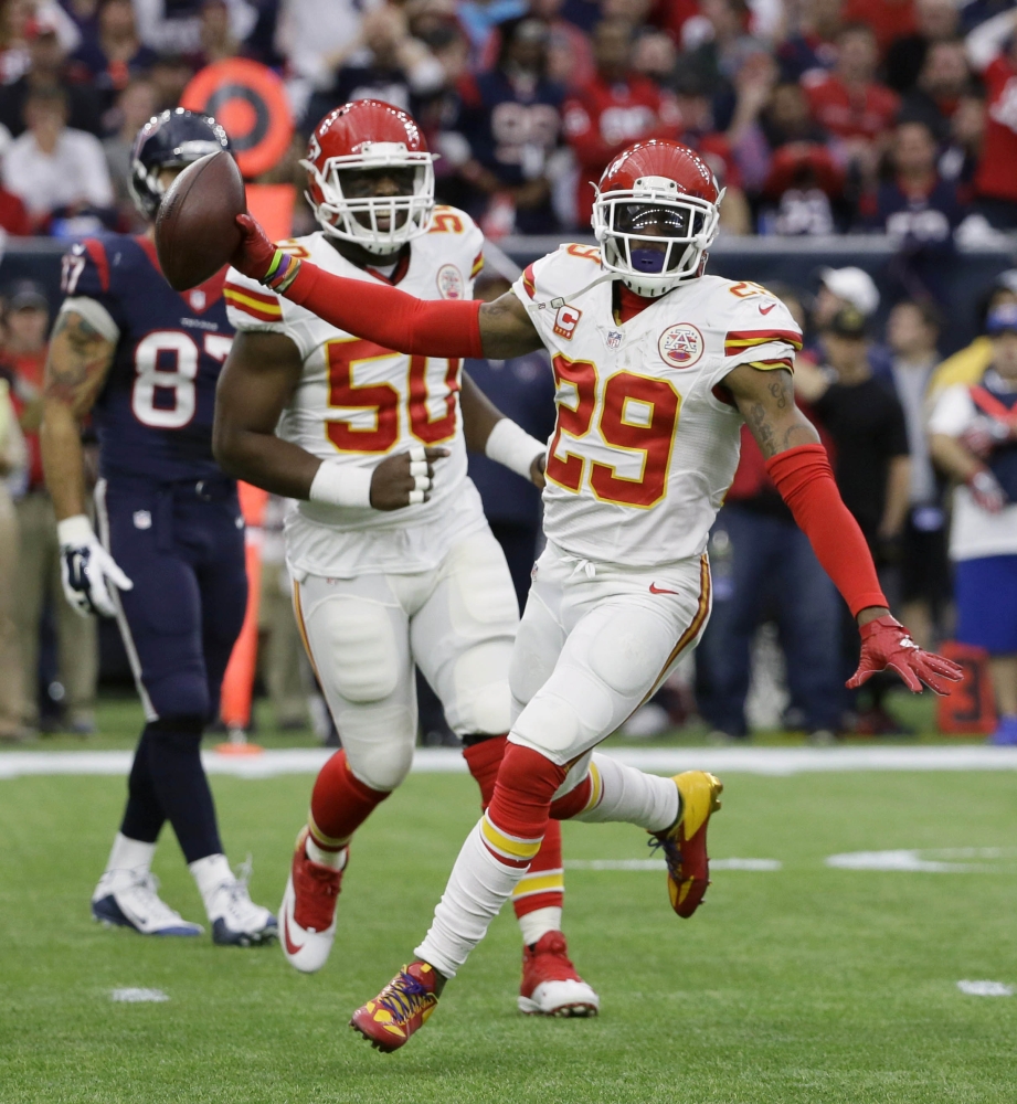 Kansas City Chiefs free safety Eric Berry, right, celebrates his interception against the Texans during a 30-0 wild-card win Saturday at Houston. The Chiefs, who had just six interceptions last season, rang up 22 this year.