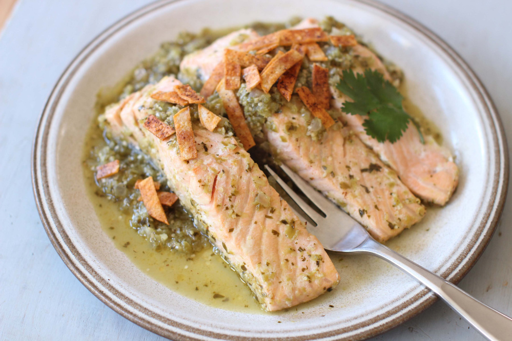 Salmon poached in green salsa and topped with baked chips. This dish is delicious cold or hot.