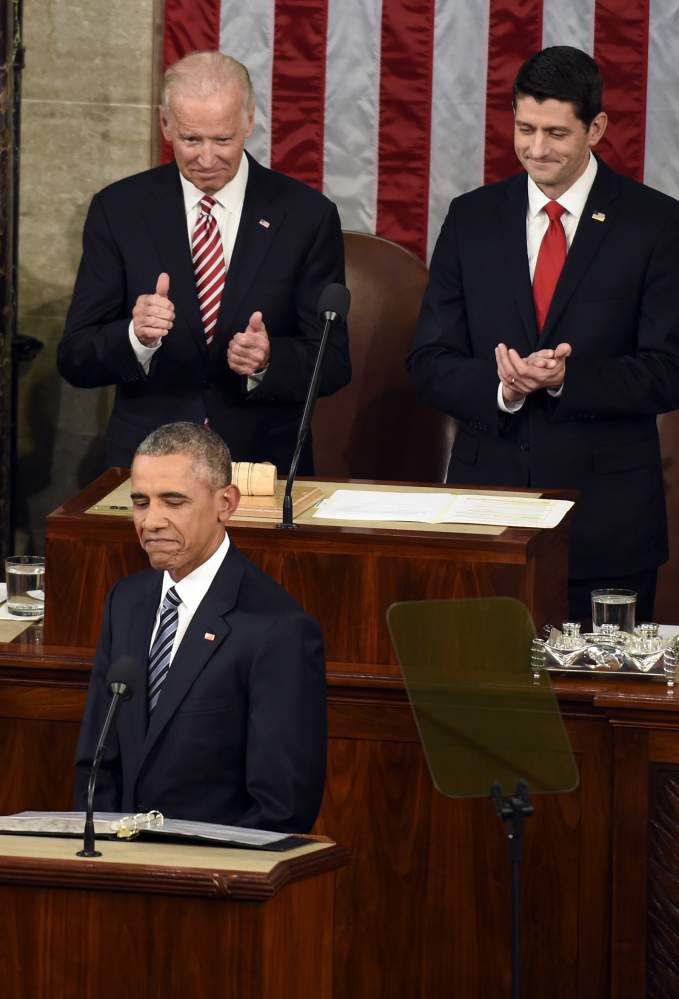 Vice President Joe Biden and House Speaker Paul Ryan of Wisconsin applaud as President Obama pauses Tuesday during his State of the Union address to a joint session of Congress on Capitol Hill. “For this final (address), I’m going to try to make it shorter,” the president said at the start. “I know some of you are antsy to get back to Iowa.”