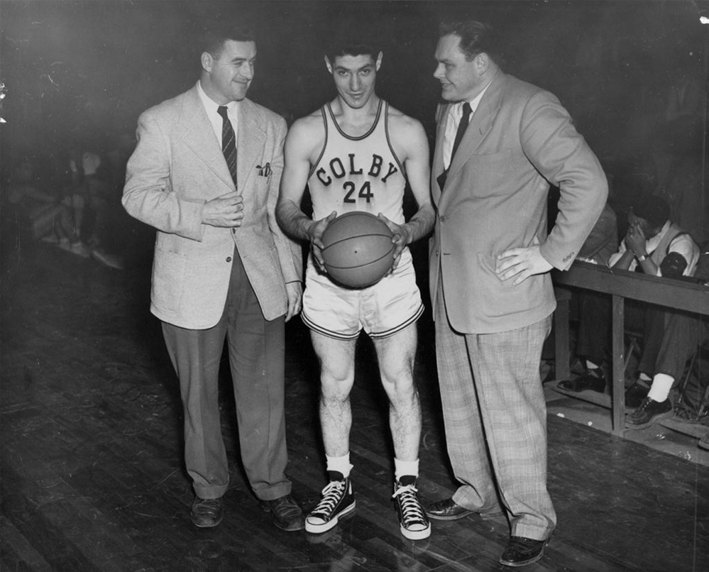 Ted Shiro is shown with Colby head basketball coach Lee Johnson, right, and an unidentified coach at left. Shiro was the first Colby basketball player to score 1,000 points.