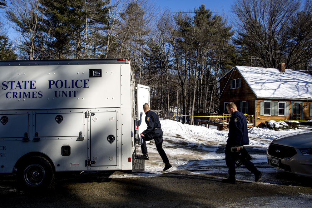 Windham Police Detective Gene Gallant and State Police Detective Lawrence Rose work the scene of a fatal shooting Thursday at 37 Brookhaven Drive in Windham. Alicia Gaston, 34, died in the incident.
