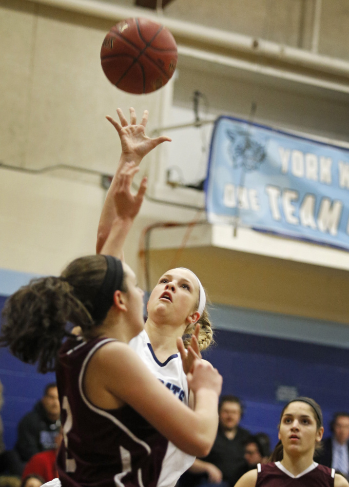 YORK - JANUARY 15:  York #20 Chloe Smedley sends up a shot over Greely #3 Moira Train (cq) during first half basketball at York. (Photo by)