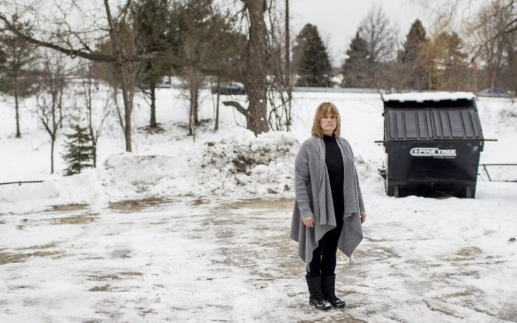 Cynthia Callnan, who says two rats crawled over her feet in broad daylight when she brought trash to the Dumpster outside her apartment building, is one of many to complain to city and state officials about an infestation in the Libbytown neighborhood.
