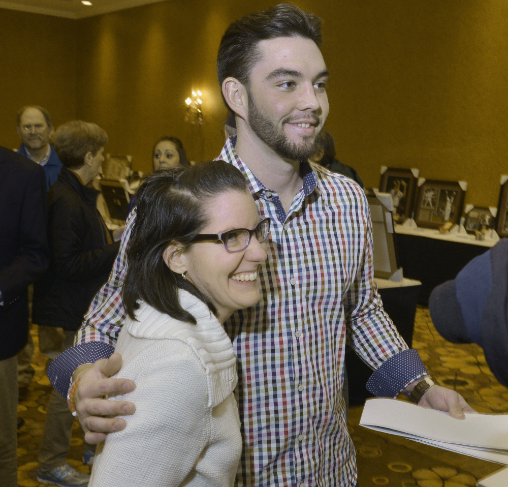 Blake Swihart, who had an impressive first season with the Boston Red Sox, poses for a photo with Janelle Boehm of Sebago during the Sea Dogs’ annual dinner Friday night.