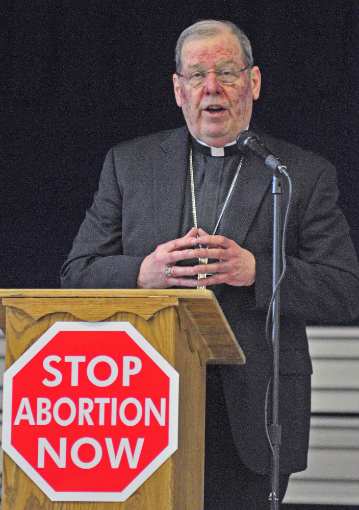 Bishop Robert Deeley of the Roman Catholic Diocese of Portland speaks on Saturday during the Maine Right to Life Committe’s annual Hands Around the Capitol memorial at St. Michael School in Augusta. 