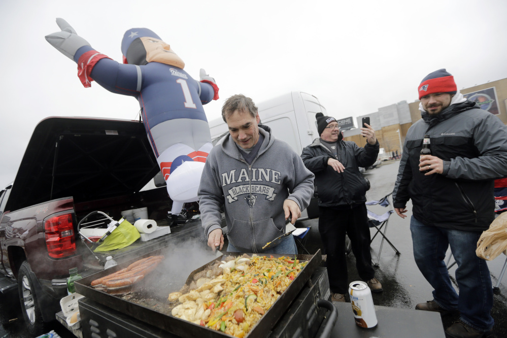 Pete Roy, wearing his Maine Black Bears sweatshirt, was a favorite in the Gillette Stadium parking lot Saturday, tailgating with friends before the New England Patriots’ playoff game against the Kansas City Chiefs.
