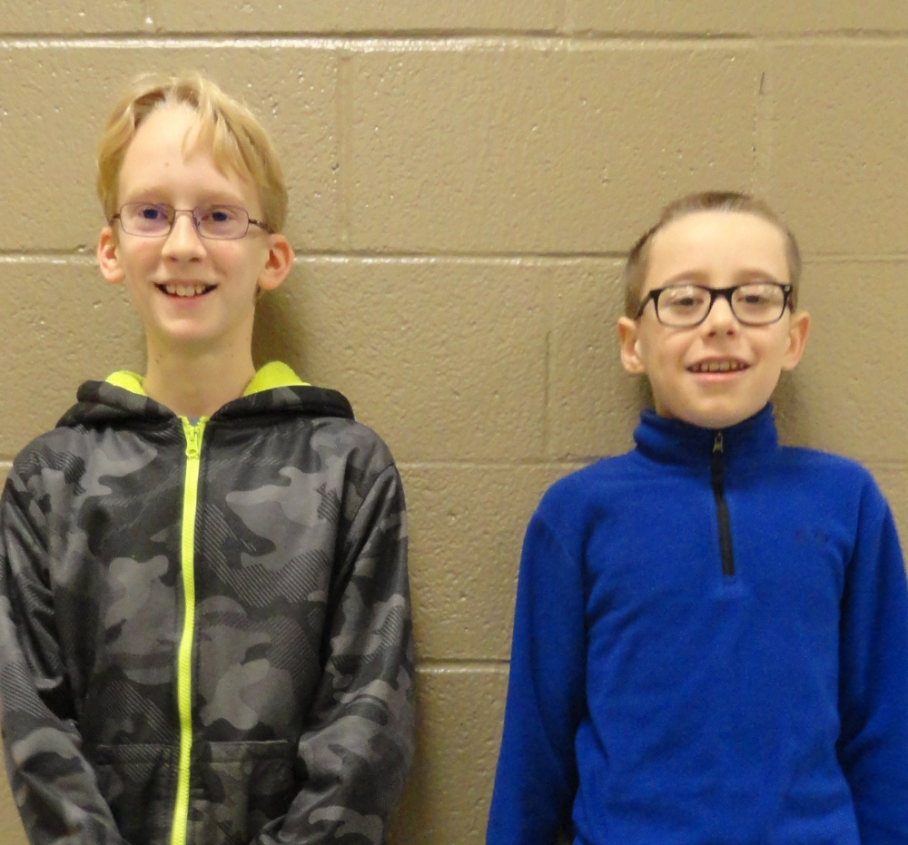 Sixth-grade Saco Middle School students Will Barry, left, and Henry Clark were named winner and runner-up, respectively, in a schoolwide spelling bee. Both will advance to the York County Spelling Bee in February.