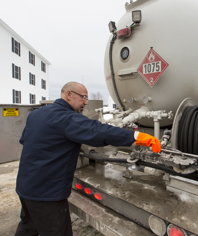 Dave Marr of Fielding’s Oil and Propane Co. delivers propane Friday to a housing development in Scarborough.