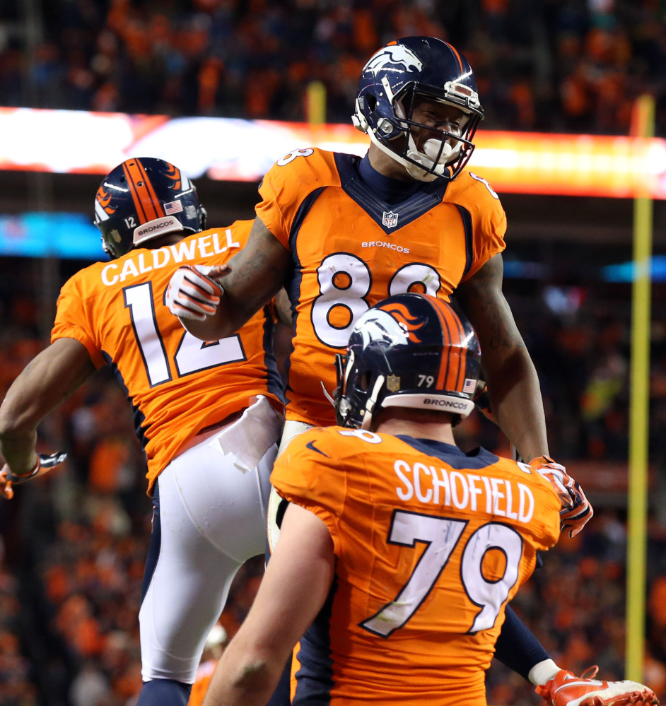 Broncos wide receiver Demaryius Thomas celebrates with teammates after catching a 2-point conversion pass in the fourth quarter Sunday, helping Denver earn a spot in the AFC championship game with a 23-16 win over the Steelers.