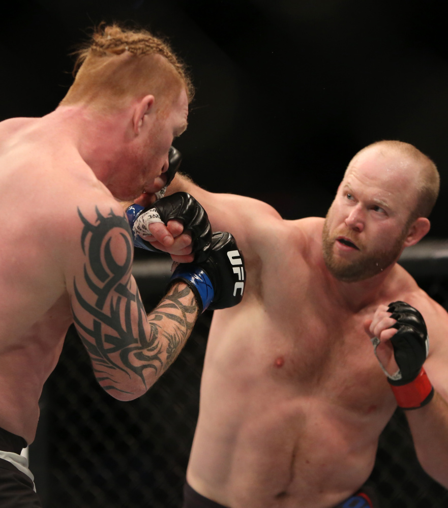 Tim Boetsch, right, of Lincolnville looks for an opening Sunday night against Ed Herman during a UFC fight in Boston. Herman won by second-round knockout.