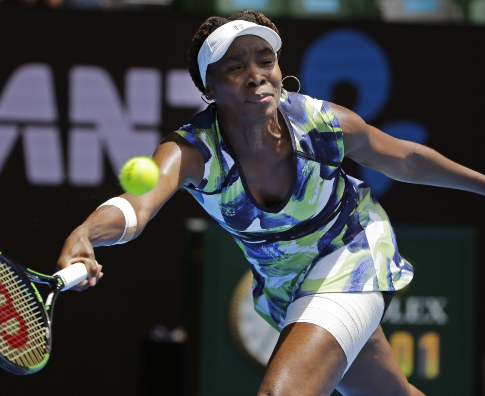 Venus Williams reaches for a forehand return to Johanna Konta during a first-round match at the Australian Open in Melbourne on Tuesday.