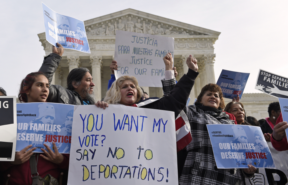 Members of CASA de Maryland participate in a immigration rally outside the Supreme Court in Washington, Friday.