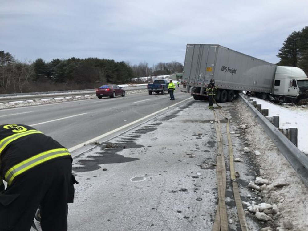 Courtesy Maine State Police
A tractor-trailer lies alongside the Maine Turnpike in Scarborough on Tuesday after a multi-vehicle crash.