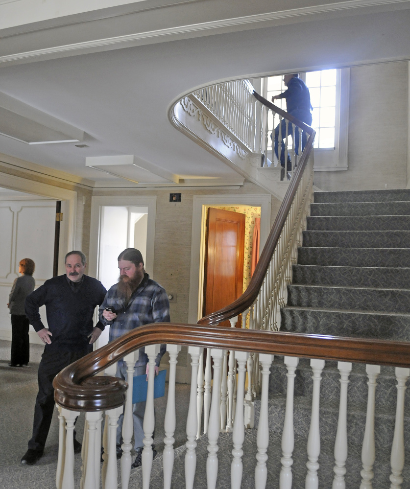 Guests explore the Gannett House in Augusta on Tuesday during announcement by heirs of Maine publisher Guy Gannett that the former state office building will be converted into a First Amendment museum.