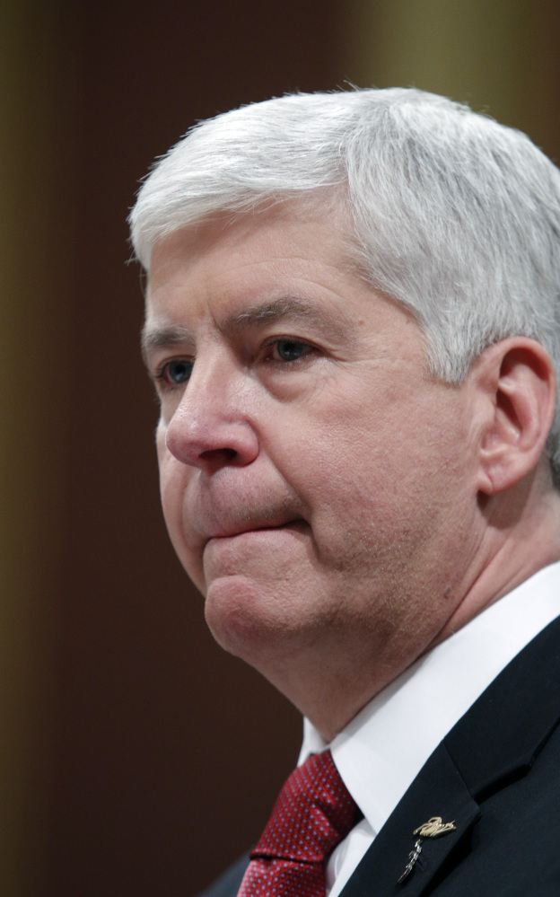 GOV. RICK SNYDER
pauses as he delivers his State of the State address to a joint session of the House and Senate, Tuesday, Jan. 19, 2016, at the state Capitol in Lansing, Mich. With the water crisis gripping Flint threatening to overshadow nearly everything else he has accomplished, the Republican governor pledged a fix Tuesday night during his annual State of the State speech. (AP Photo/Al Goldis)