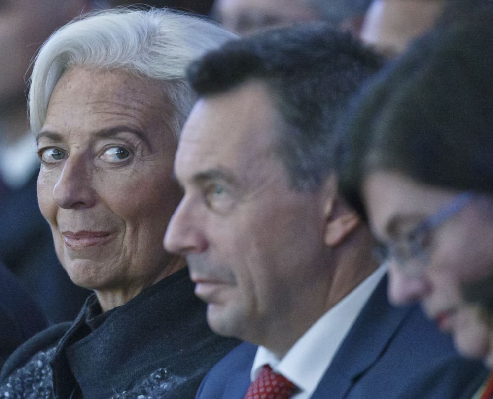International Monetary Fund managing director Christine Lagarde, left, attends the plenary session of the World Economic Forum in Davos, Switzerland, Wednesday.