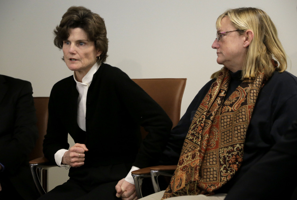 Anne Scott, of Charlottesville, Va., left, and Katie Wales Lovkay, of Granby, Conn., right, who stated they were sexually assaulted at St. George’s School as students, face reporters at a news conference in Boston earlier this month.