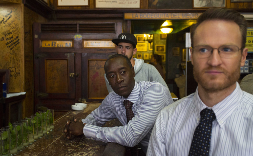 “House of Lies” actors Don Cheadle and Josh Lawson, right, sit at a counter in Bodeguita Del Medio during the filming of an episode in Havana, Cuba. The producers of Showtime’s dark comedy wanted to shoot the first episode of scripted American television in Cuba in more than half a century.