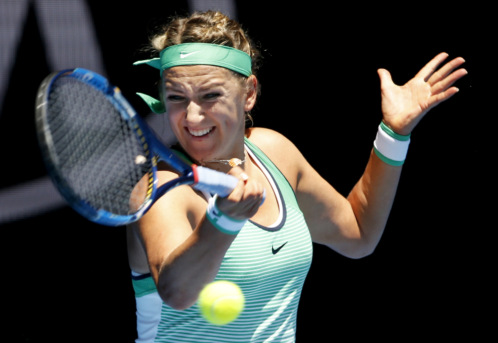 Victoria Azarenka of Belarus hits a forehand return to Naomi Osaka of Japan during their third-round match Saturday at the Australian Open. Azarenka, a two-time Australian Open champion, advanced with a 6-1, 6-1 win.