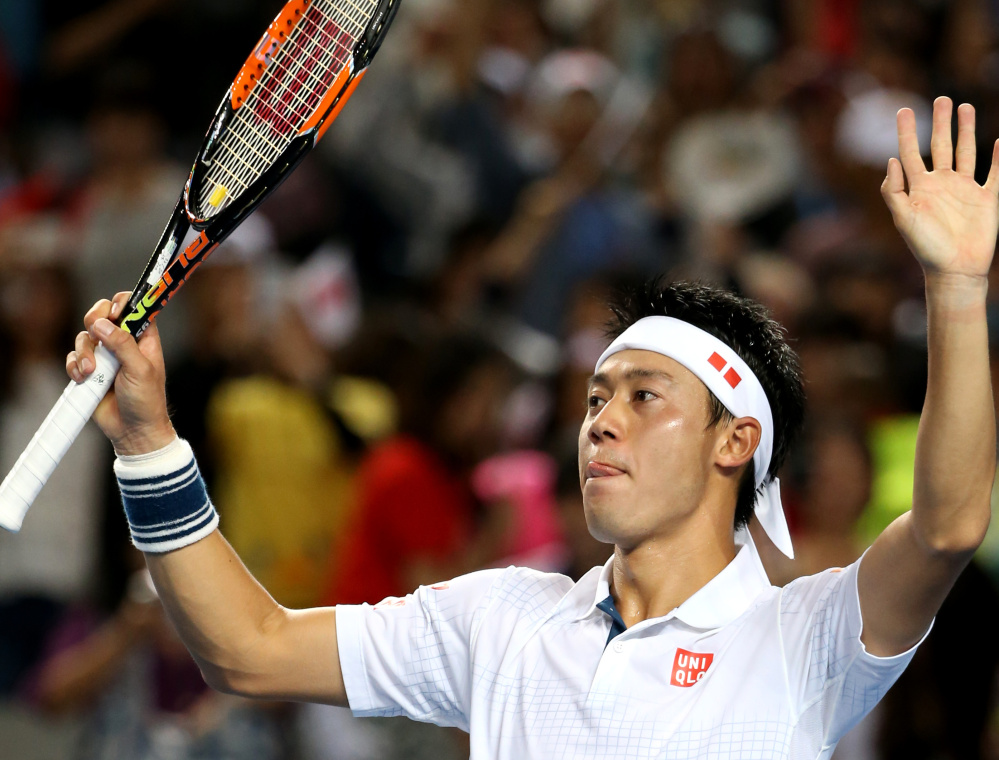 Kei Nishikori celebrates after defeating Jo-Wilfried Tsonga 6-4, 6-2, 6-4 to advance to the quarterfinals. Nishikori was a finalist at the U.S. Open in 2014.