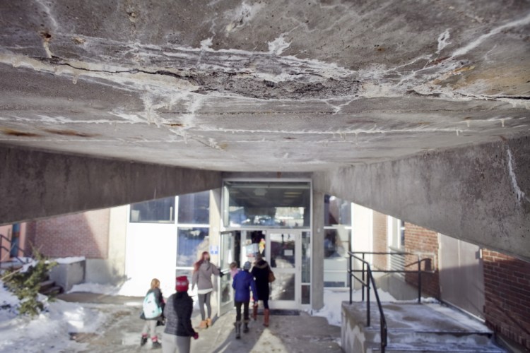 A section of crumbling concrete is seen in January on the underside of a ramp at the Howard C. Reiche Community School in Portland. The school would get $17.9 million worth of repairs and improvements under the proposed borrowing plan.
Joel Page/Staff Photographer