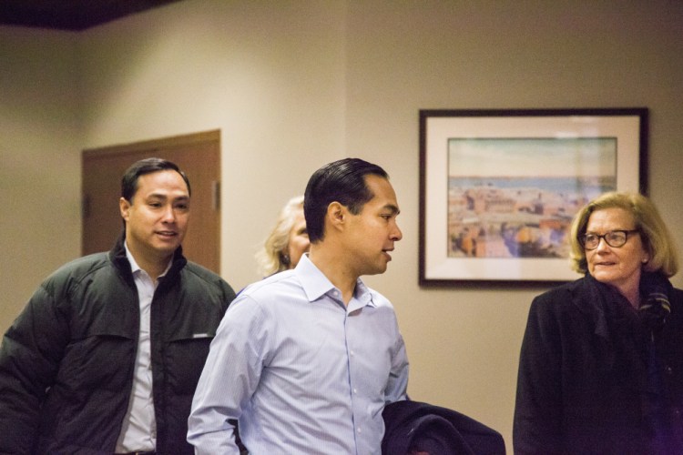 U.S. Secretary of Housing and Urban Development Julian Castro, center, walks with his brother Rep. Joaquin Castro, as they  attend a fundraising event for Hillary Clinton’s presidential campaign at Preti Flaherty in Portland on Monday. Whitney Hayward/Staff Photographer