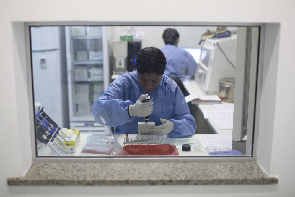 A graduate student works on analyzing samples to identify the Zika virus in a laboratory at the Fiocruz institute in Rio de Janeiro, Brazil, on Friday.